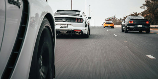 Mustangs racing on track